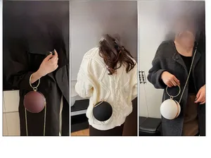 Three spherical evening bags in burgundy black and white with gold ring handles