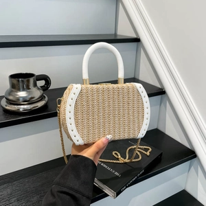 Straw handbag with white handles and gold rivets for summer vacation style