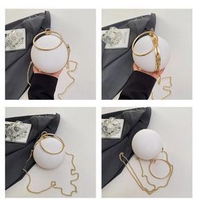 Detail shots of white spherical evening bag with metal ring handle and chain strap
