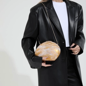 Fashionable amber marble acrylic clutch with eggshell shape and gold chain for women