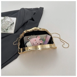 Gold wave frame evening clutch bag with chain strap and spacious interior capacity