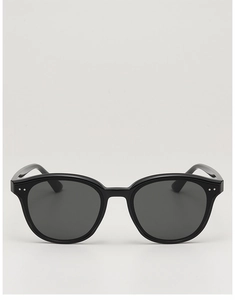 Front view of black small frame sunglasses with silver dots and grey lenses
