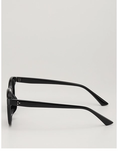 Detailed side view of glossy black sunglasses featuring three silver metal accent studs