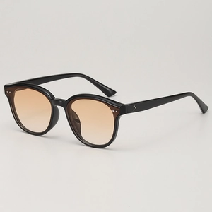 Classic black frame sunglasses with amber lenses shown from a 45-degree angle