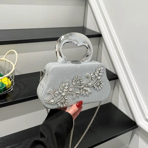 Sparkling silver evening bag with rhinestone flower and metallic handle for women