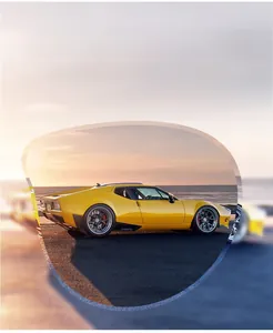 Polarized lens detail showing glare reduction and high clarity on a coastal road scene