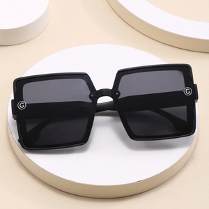 Elegant oversized square black sunglasses for women with metallic G logo detail on the side
