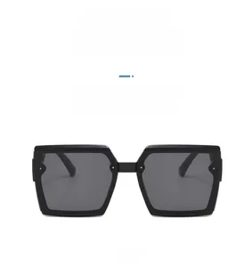 Front view of trendy square frame sunglasses in glossy black with dark grey lenses