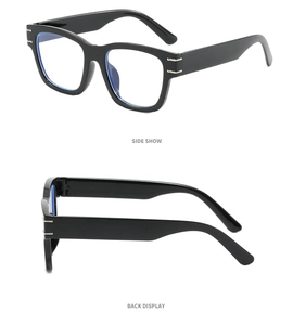 Close-up of vintage black square glasses frame with silver metal accents on the side hinge