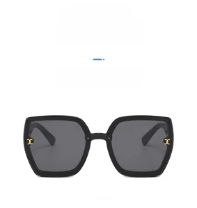 Front view of black oversized square sunglasses with gold accents and beaded edge detail