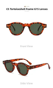 Detail of vintage round tortoiseshell sunglasses with metal rivets and G15 lenses