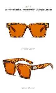 Detail of square tortoiseshell sunglasses with orange lenses and metal arrow accents