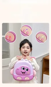 Pink cartoon dinosaur toddler backpack with glowing light-up feet detail shown on a girl