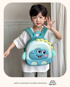 Detail showing cartoon dinosaur 3D fins on toddler backpack with green EVA material