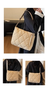 Detail of beige quilted puffer bag featuring side metal zipper and wide adjustable strap
