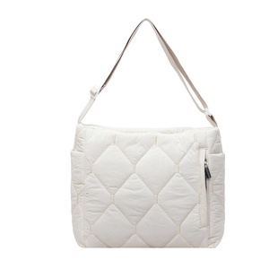 White quilted puffer crossbody bag with adjustable shoulder strap and minimalist design