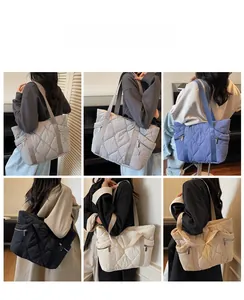 Showcasing six available colors of large quilted puffer tote bags with side zipper pockets