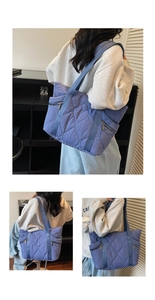 Detail of blue quilted puffer tote bag showing side zipper pocket and nylon texture