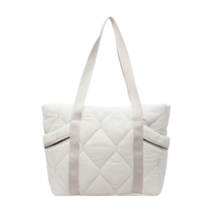 Detail of white quilted nylon tote bag featuring puffer texture and silver side zippers