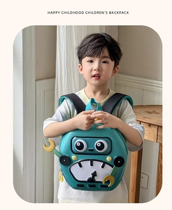 Robot-themed green EVA shell kids backpack shown on child model in cozy home setting