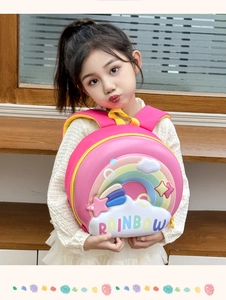 Detail of pink EVA eggshell backpack for kids featuring 3D rainbow and star patterns
