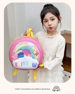 Pink EVA hard shell backpack for kids featuring 3D rainbow relief and yellow straps