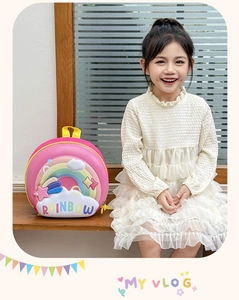 Detailed view of 3D embossed rainbow design on durable EVA pink preschool backpack