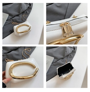 Detailed views of the white leather mini bag with golden C-handle and gold chain strap