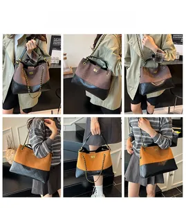 Detailed view of quilted suede tote with metal chain strap and turn-lock closure