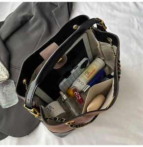 Detailed interior of vintage tote bag showing large capacity for tablet and cosmetics