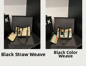 Detail of woven straw shoulder bag with black leather trim and matching inner pouch
