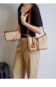 Straw woven bucket bag set with brown leather straps shown on model for daily styling