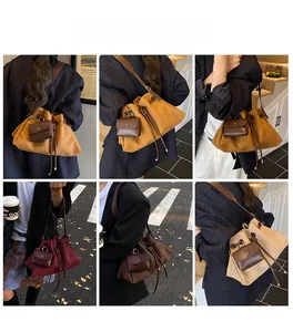 Detail of multi-color bucket bags with drawstring and small pouch in urban settings