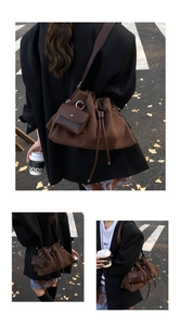 Detail of dark brown suede hobo bag with a matching small coin purse and drawstring closure