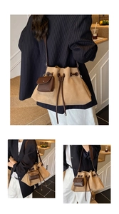 Detail view of khaki suede drawstring bucket bag with dark brown leather straps and small pouch