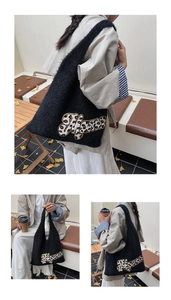 Detail of plush black Mama tote bag with leopard print patches in an outdoor setting