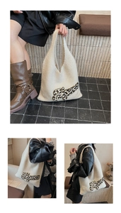 Detail of white knit tote bag with leopard pattern letter patches and spacious design