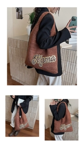 Close-up of brown knit tote with sequined Mama patch and leopard texture details