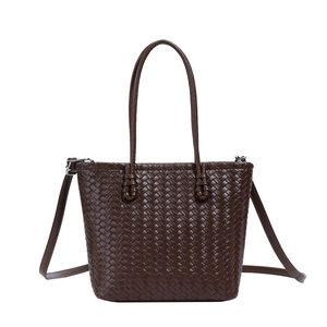 Detailed view of dark brown woven tote bag featuring fine stitching and twin handles