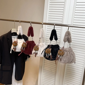 Faux fur drawstring bucket bags with leopard plush charms in five autumn colors