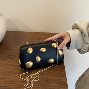 Elegant black hard-shell evening clutch bag with gold pebbles and metal chain