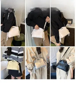 Detail shots of trendy tote bags with tassels in white beige silver and black colors