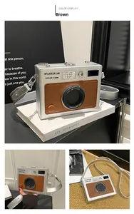 Detailed view of silver and brown leather vintage camera-shaped shoulder crossbody bag