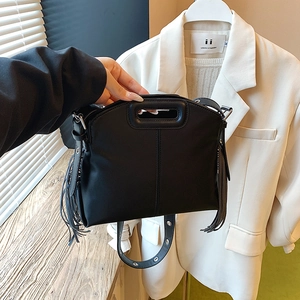 Fashionable black matte PU leather tote bag with stylish fringes and wide eyelet strap