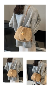 Detail of plush brown bucket bag featuring a cute carrot embroidery and slim leather strap