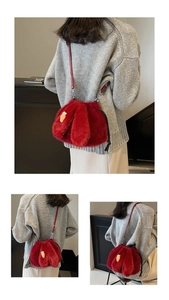 Detail of red plush bunny bucket bag with carrot embroidery and adjustable strap