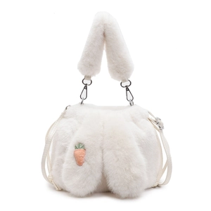 Detail of white plush bucket bag featuring cute long rabbit ears and carrot embroidery