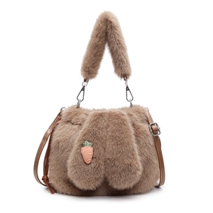 Detailed view of plush bucket bag featuring cute rabbit ears and carrot embroidery