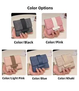 Selection of compact women's canvas wallets in black, pink, blue, and khaki colors