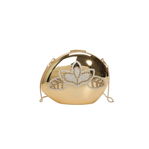 Elegant gold metal evening clutch bag with sparkling rhinestone lotus design and chain